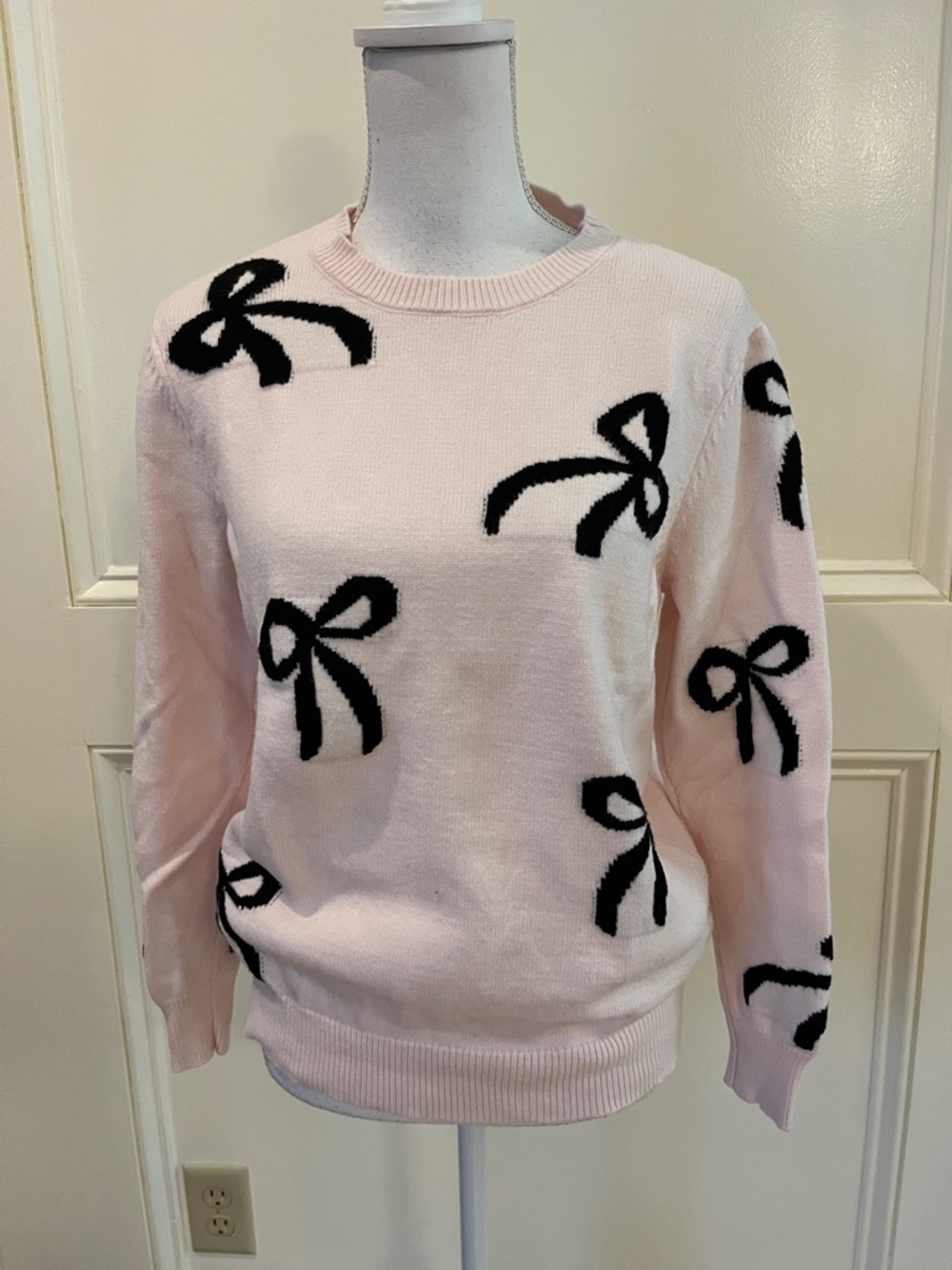 Light Pink Crewneck Sweater with Black Bow Motifs